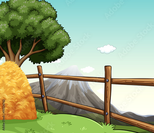 Farm scene with haystack by the fence