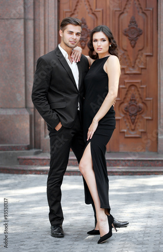 Elegant couple pose outdoors