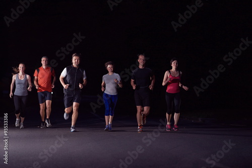 people group jogging at night