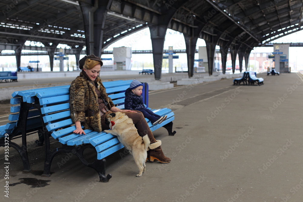 Mom with son and dog travel by train