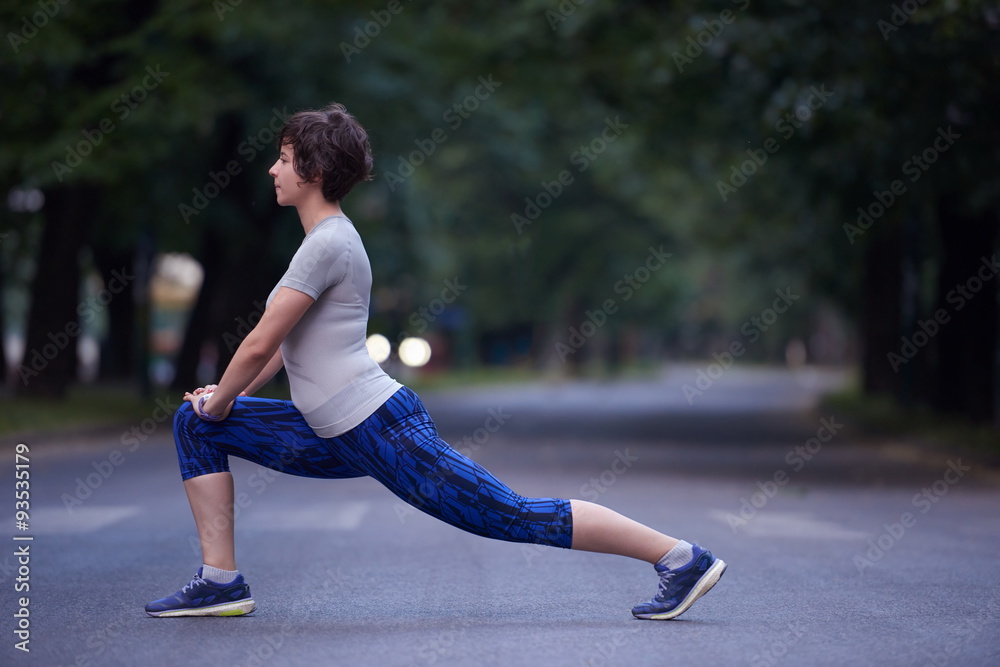 Fototapeta premium woman stretching before morning jogging