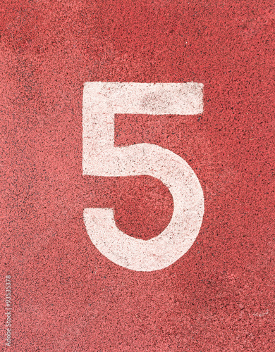 Number five,White track number on rubber racetrack, texture of r