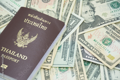us dollar banknote with Thailand passport,travel abroad must be