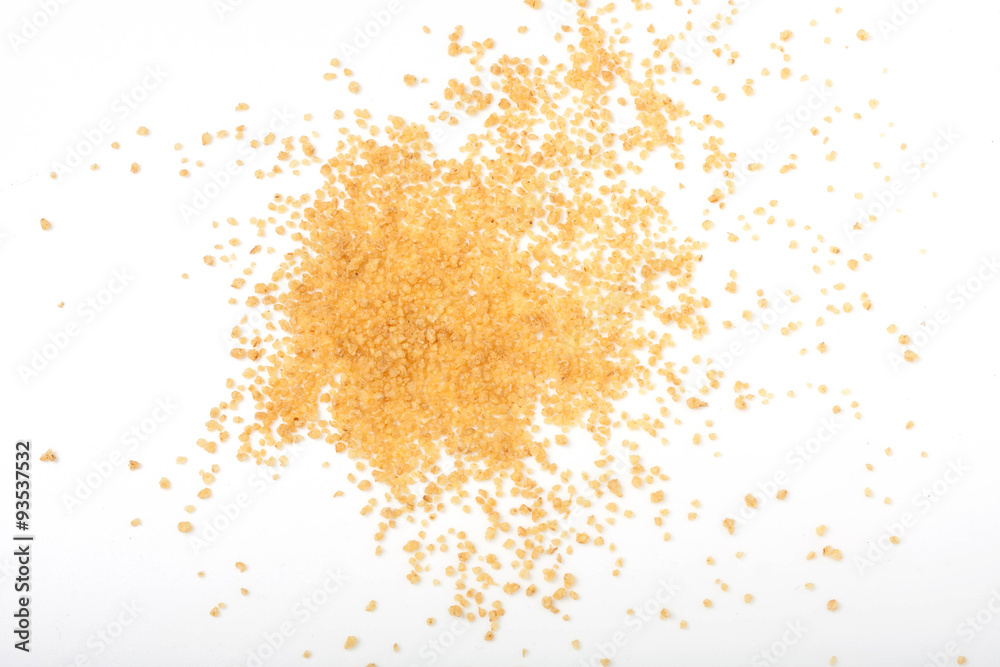 uncooked couscous scattered on white background