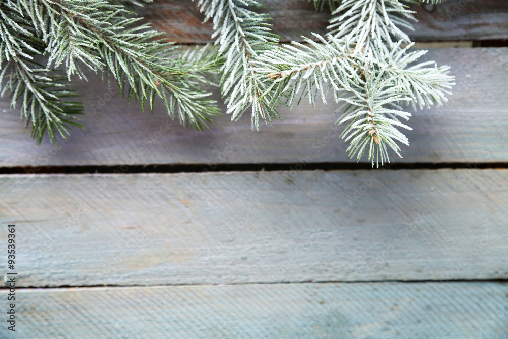 Christmas tree with frost on old wooden table Christmas tree with frost on old wooden table