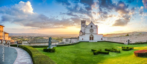 Amazing view of Basilica of St. Francis of Assisi at sunset, Umbria, Italy photo