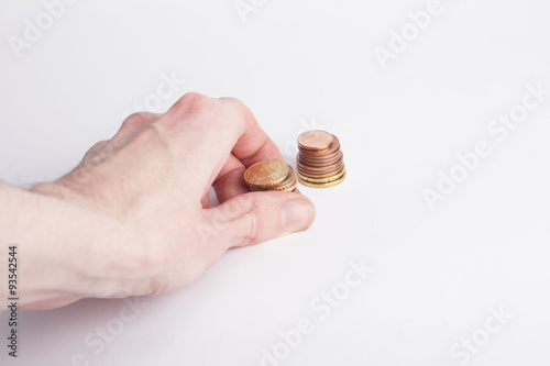 Hand and coins on white background
