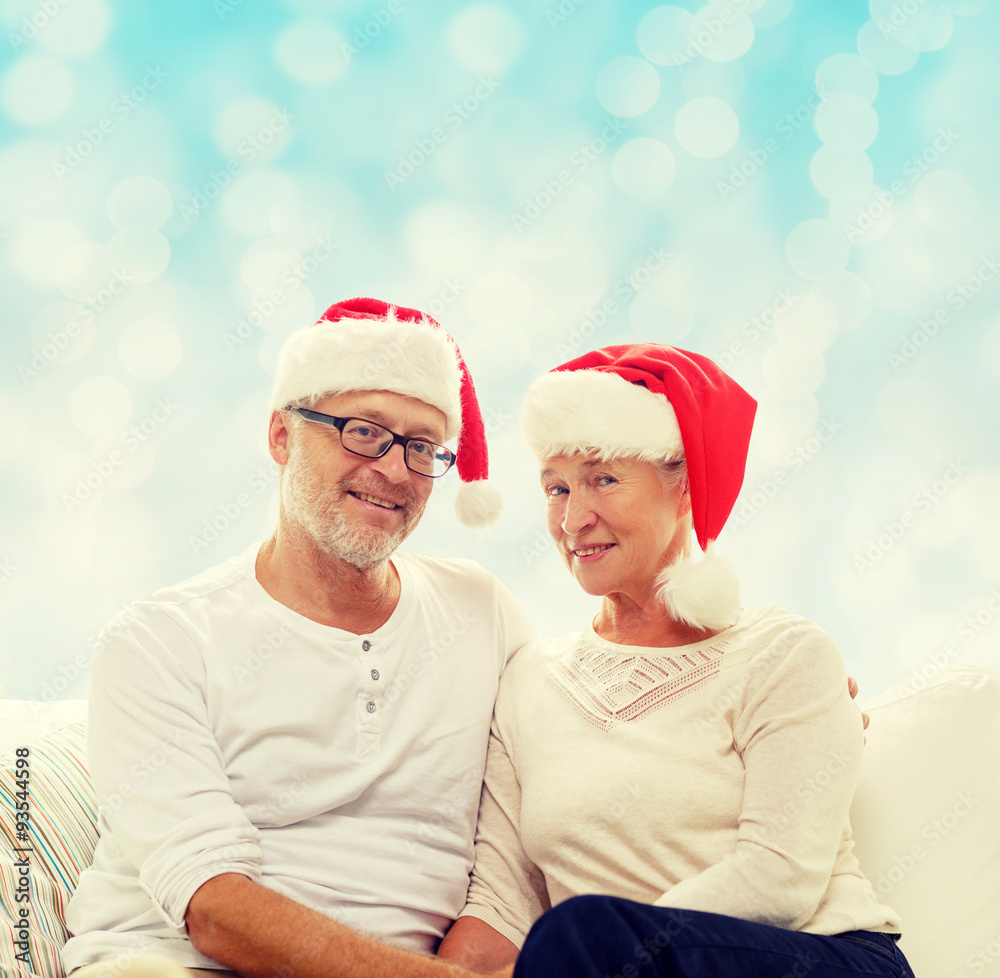happy senior couple in santa helper hats happy senior couple in santa helper hats