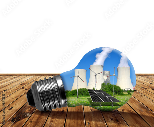 Nuclear power plant with solar panel and wind turbines in lightbulb. 