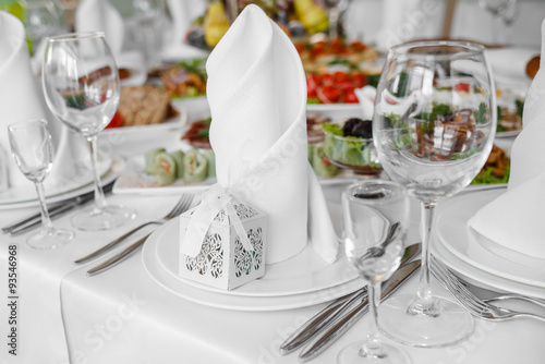 Banquet wedding table with dishware. © manifeesto