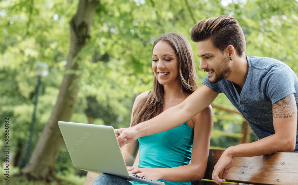 Teenagers studying at the park