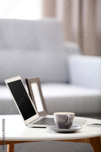 Comfortable workplace at home with laptop © Africa Studio