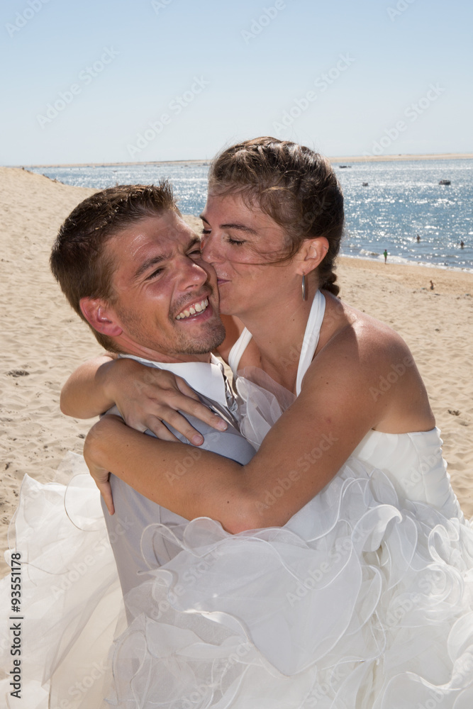 Beautiful married couple in love at summertime kissing