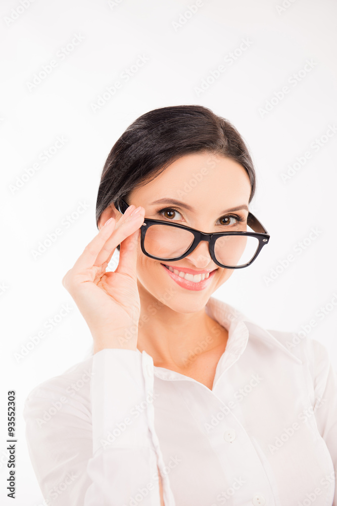 elegant cute businesswoman adjusts her glasses and smiling elegant cute businesswoman adjusts her glasses and smiling