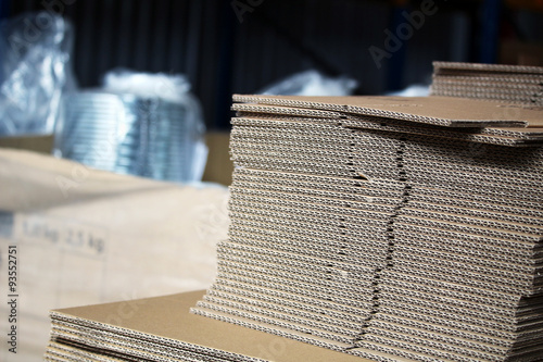 Obraz w ramie Unfolded cardboards for boxes in the warehouse