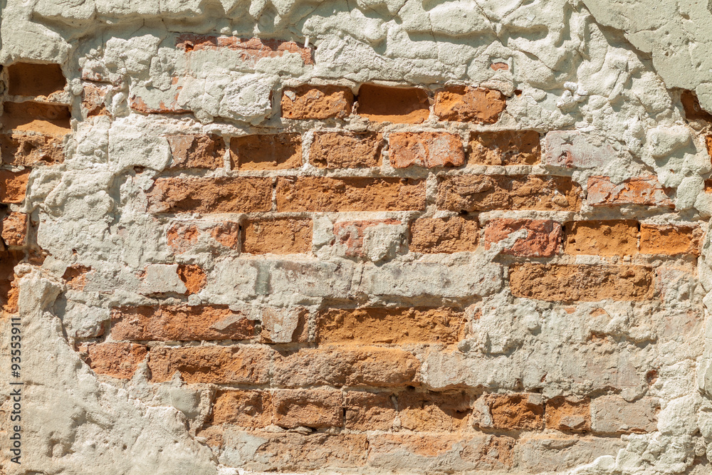 Fototapeta premium Brick wall. Vintage street brick background. Weathered texture of stainted old brik wall. Grunge rusty blocks. Urban wallpaper. Nature artistic texture. 