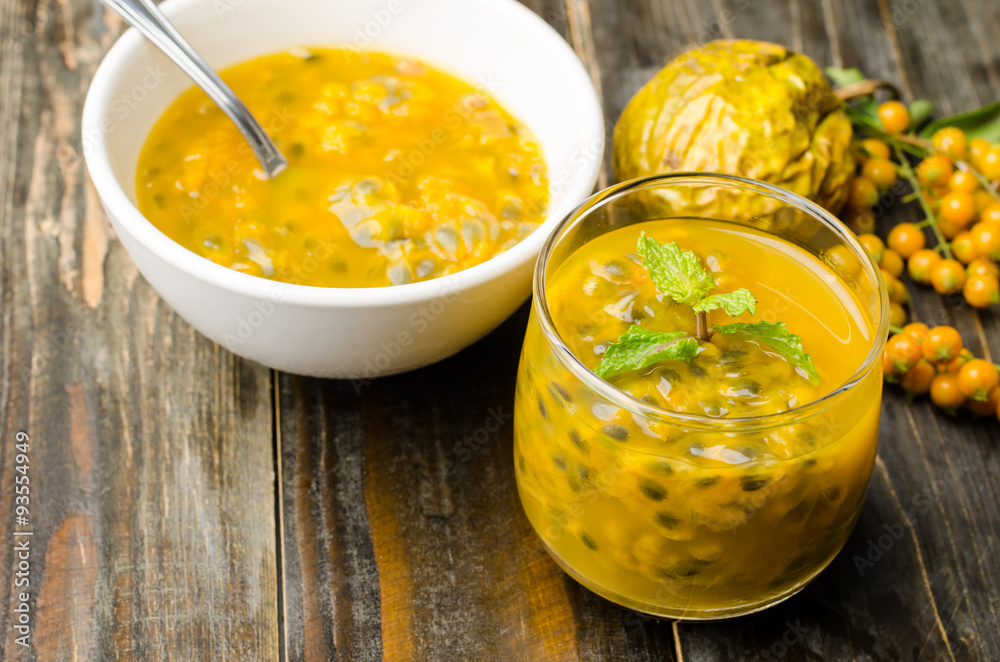 Passion fruits juice on wooden background Passion fruits juice on wooden background