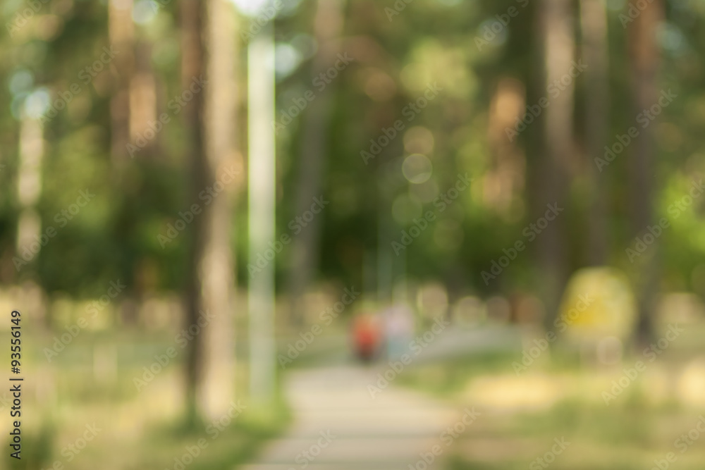 Blurry nature wallpaper. Forest bokeh background. Green defocused backdrop for your design.