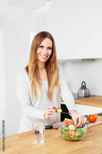Pregant woman  preparing a healthy dish