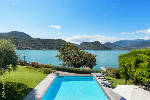 beautiful swimming pool overlooking the lake © alexandre zveiger