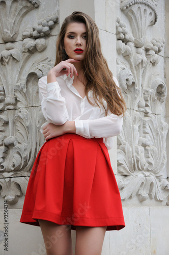 Beautiful young girl in red © pliekhova