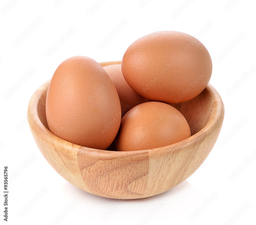 egg in a wooden bowl isolated on white background egg in a wooden bowl isolated on white background