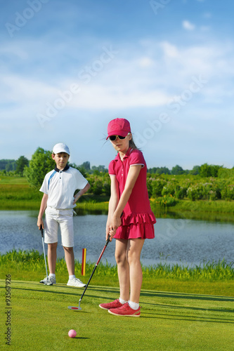 Kids playing golf