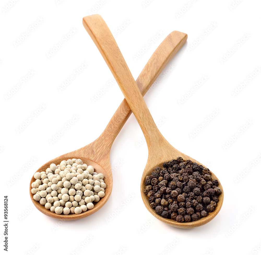 Wooden spoon and peppercorn on white background Wooden spoon and peppercorn on white background