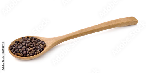 Wooden spoon and peppercorn on white background