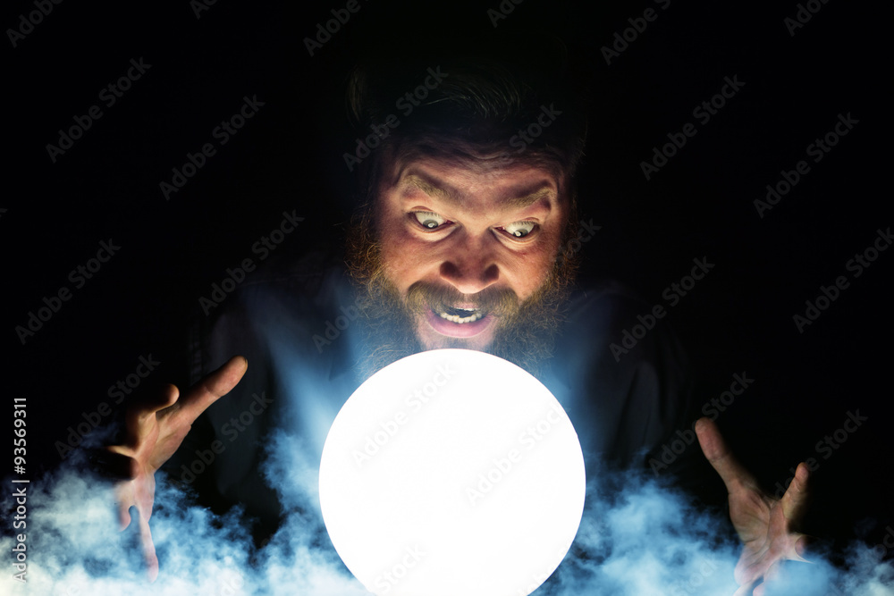 Fototapeta premium Dark wizard is making magic with the magic crystal.