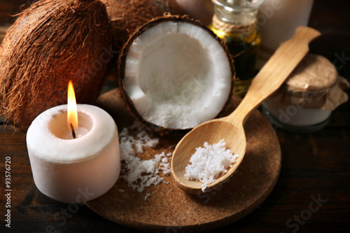 Spa coconut products on dark wooden background