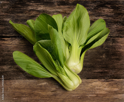 Overhead shot of Chinese cabbage, Bok Choy, on rustic wood