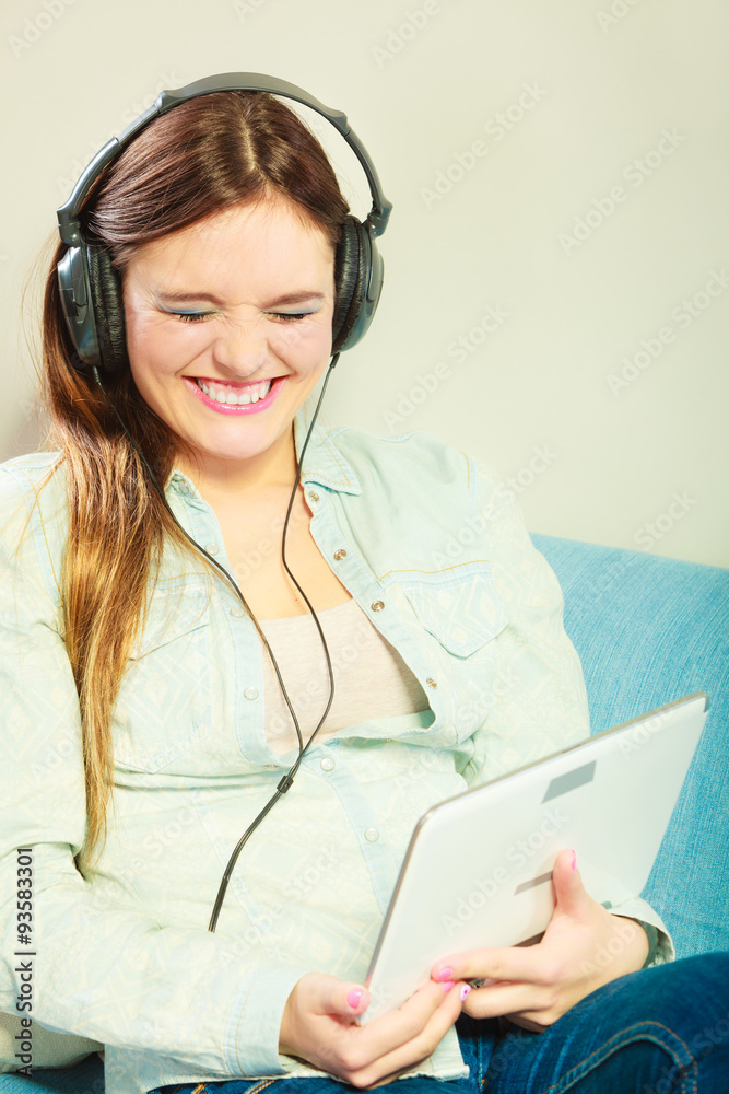 Woman with tablet headphones relaxing Woman with tablet headphones relaxing