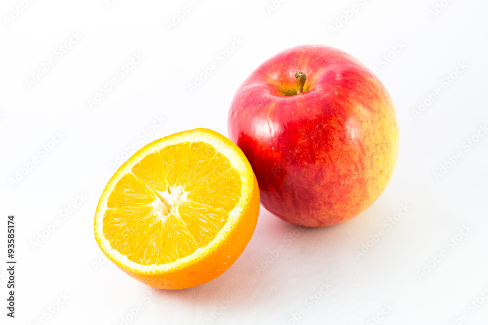 Apple with half orange on white background. Apple with half orange on white background.