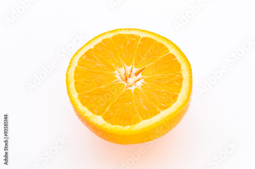 Half orange fruit on white background, fresh and juicy.