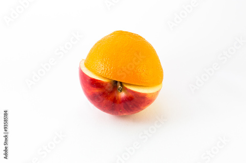Creative apple combined from red apple and orange half isolated