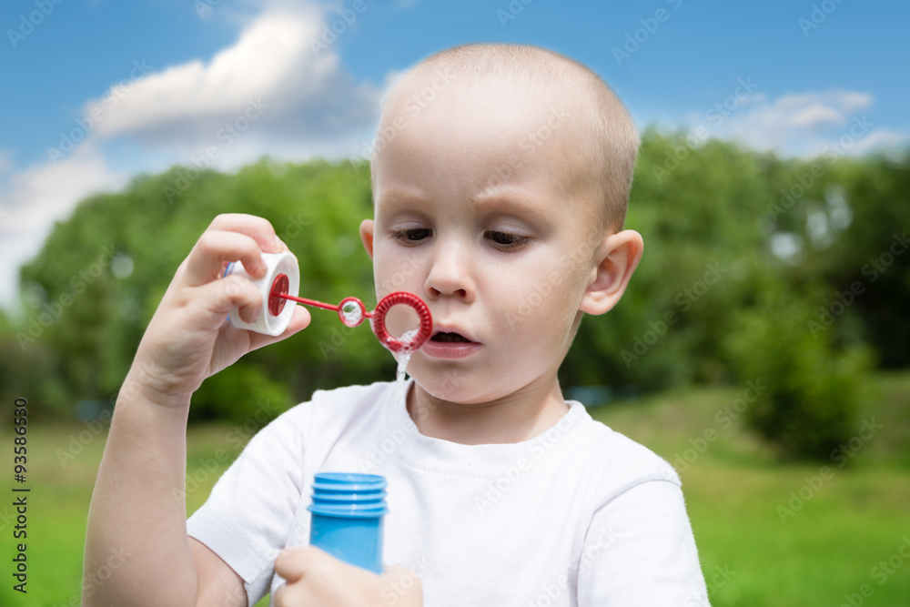 Little boy blowing soap bubbles Little boy blowing soap bubbles