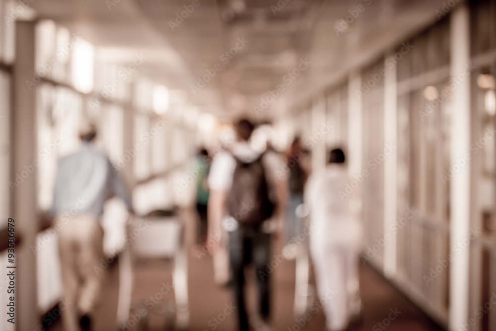 Blur image of passengers walking at airport Blur image of passengers walking at airport