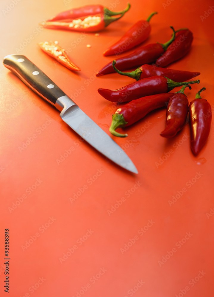 Red chili pepper with knife Stock Photo | Adobe Stock