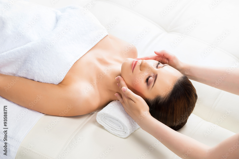Beautiful woman laying on a mat in massage salon. Beautiful woman laying on a mat in massage salon.