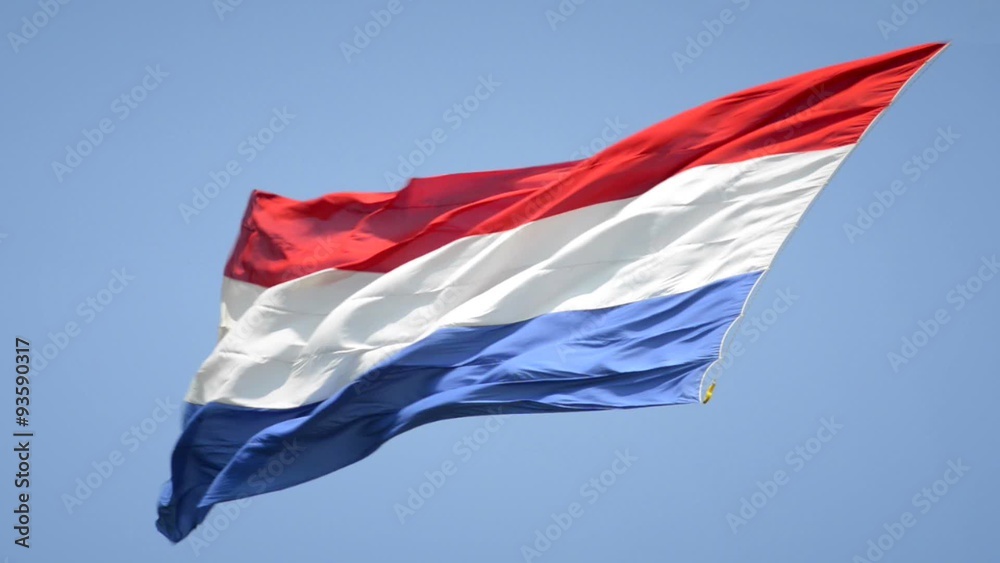 Dutch Flag of The Netherlands with red, white and blue stripes in the wind.