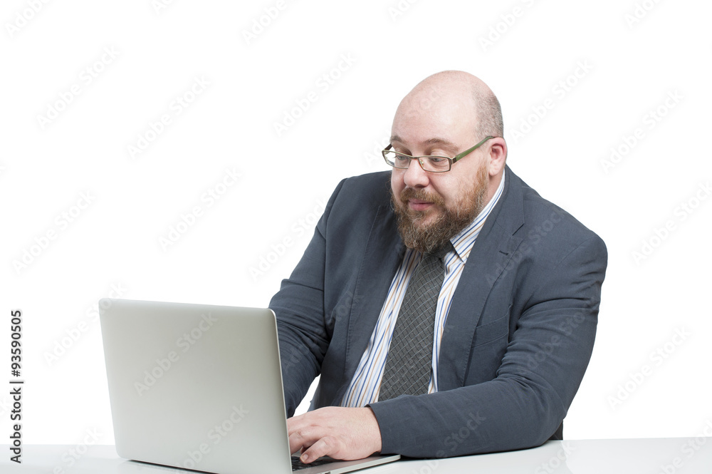 Man in a jacket works at the computer.. Man in a jacket works at the computer..