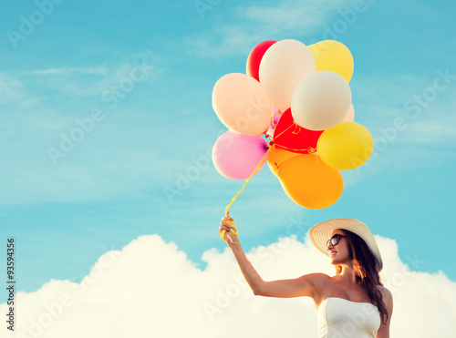 smiling young woman in sunglasses with balloons © Syda Productions