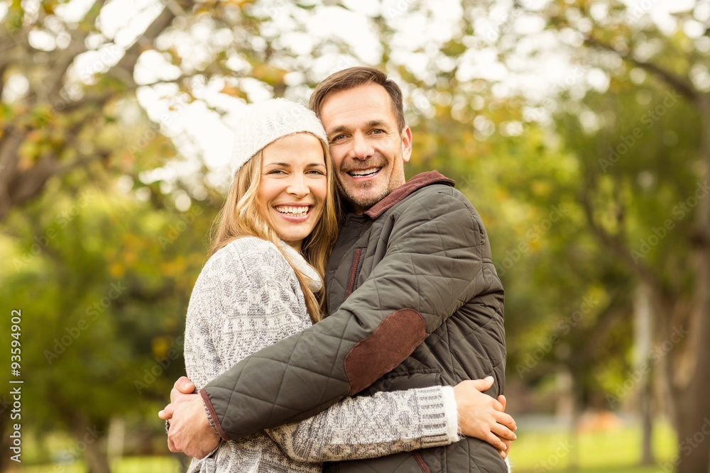 Portrait of smiling young couple embracing Portrait of smiling young couple embracing