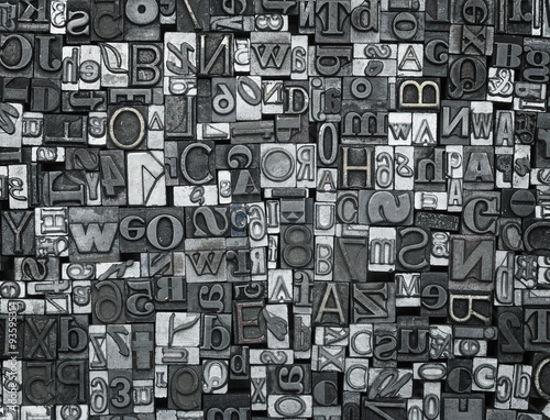 Letterpress background, close up of old metal letters photo