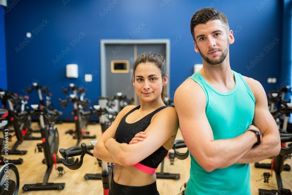 Focused couple working out together Focused couple working out together