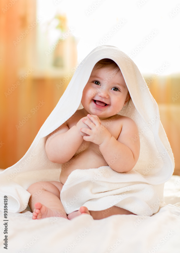 baby girl sitting under a hooded towel after bath Stock Photo Adobe Stock