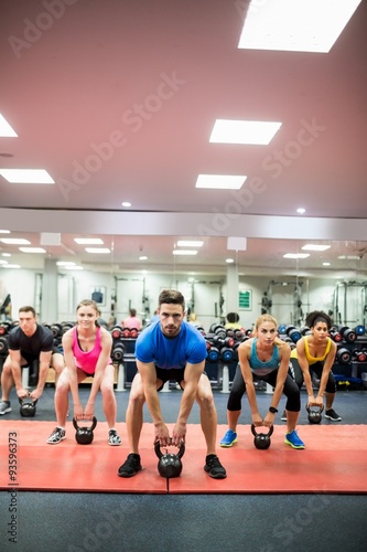 Fototapeta Naklejka Na Ścianę i Meble -  Fit people working out in fitness class