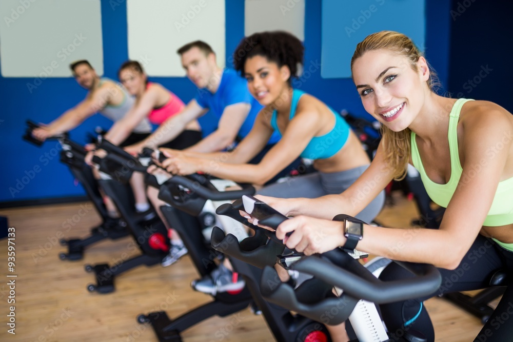 Fit people in a spin class Fit people in a spin class