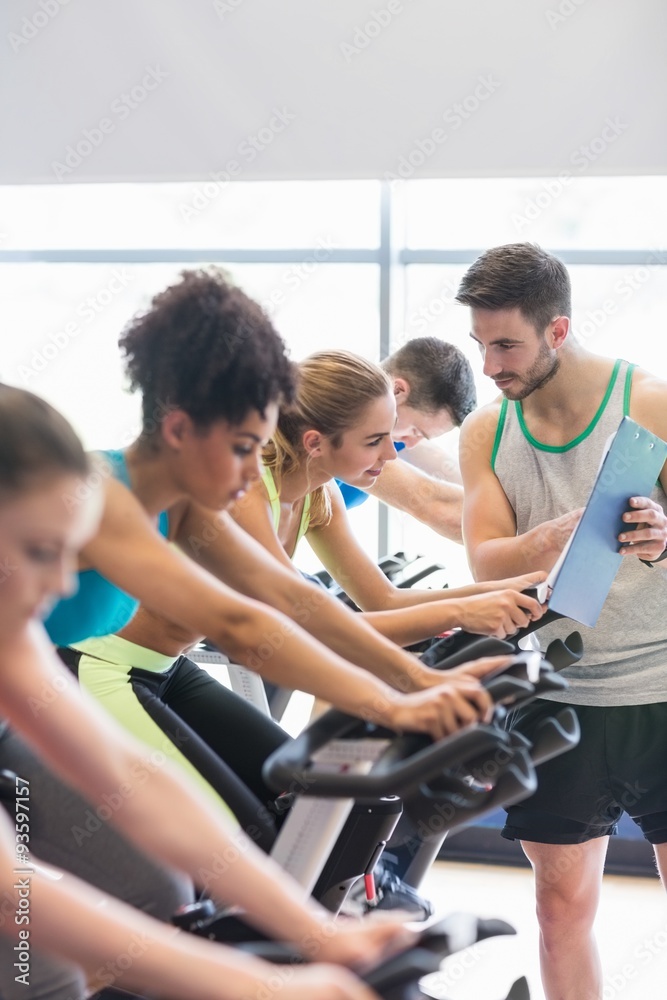 Fit people in a spin class Fit people in a spin class